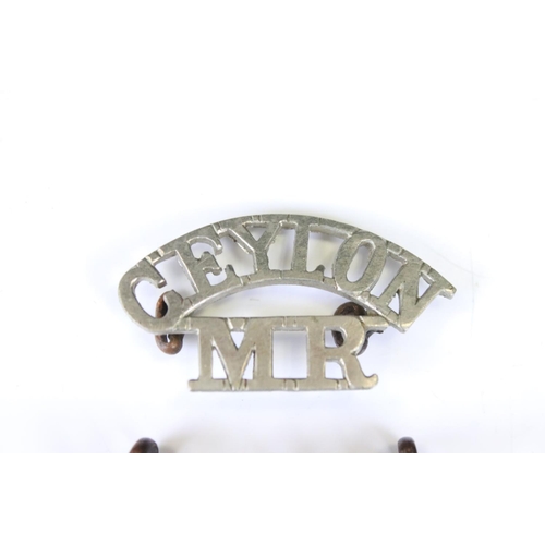 236 - A Pair Of Blackened Ceylon Planters Rifle Corps Shoulder Titles Together With A White Metal Ceylon M... 