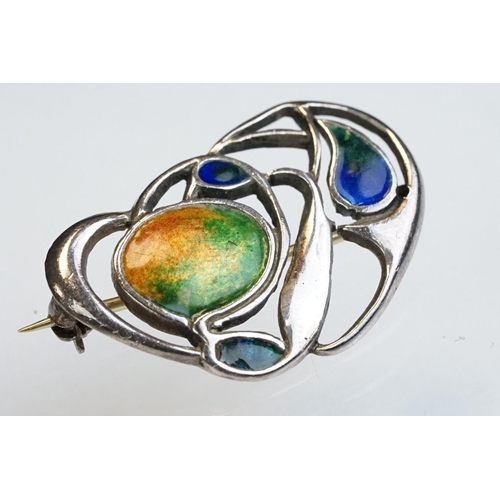 6 - Archibald Knox for Liberty & Co Cymric enamelled silver brooch, the sinuous entwined design with ora... 