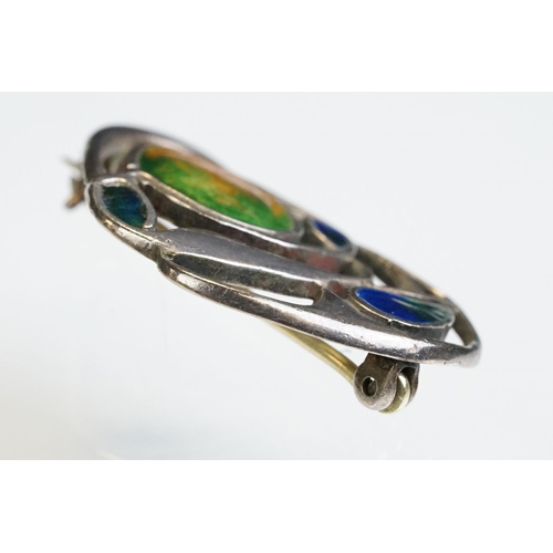 6 - Archibald Knox for Liberty & Co Cymric enamelled silver brooch, the sinuous entwined design with ora... 