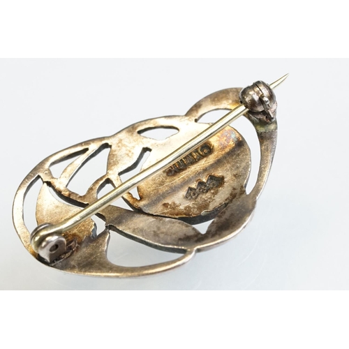 6 - Archibald Knox for Liberty & Co Cymric enamelled silver brooch, the sinuous entwined design with ora... 