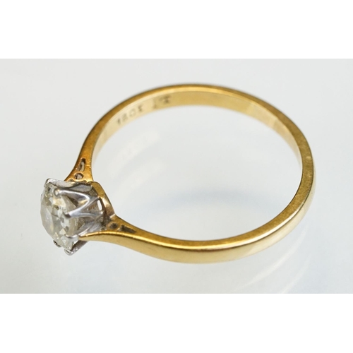 8 - Diamond solitaire 18ct yellow gold and platinum set ring, the oval cushion cut diamond weighing appr... 