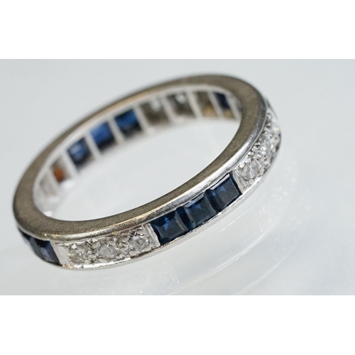 9 - Diamond and sapphire white metal eternity ring, a total of twelve round brilliant cut diamonds, pavé... 