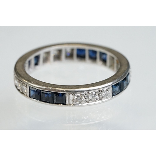 9 - Diamond and sapphire white metal eternity ring, a total of twelve round brilliant cut diamonds, pavé... 
