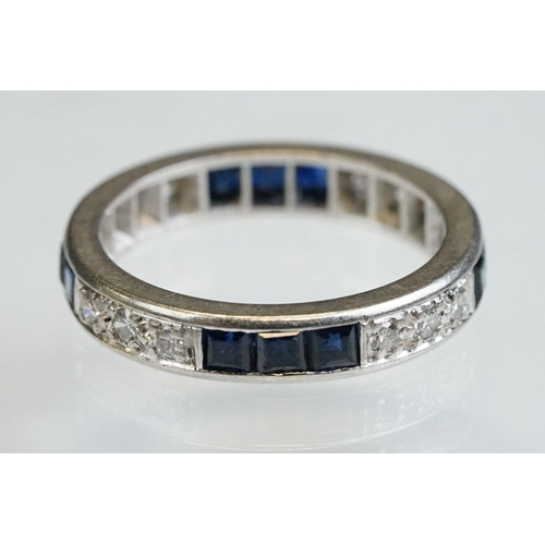 9 - Diamond and sapphire white metal eternity ring, a total of twelve round brilliant cut diamonds, pavé... 