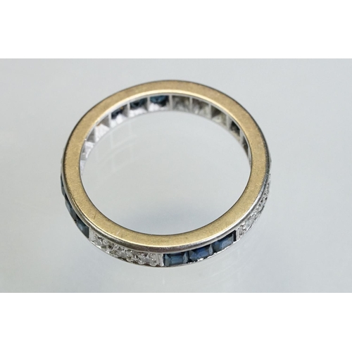 9 - Diamond and sapphire white metal eternity ring, a total of twelve round brilliant cut diamonds, pavé... 