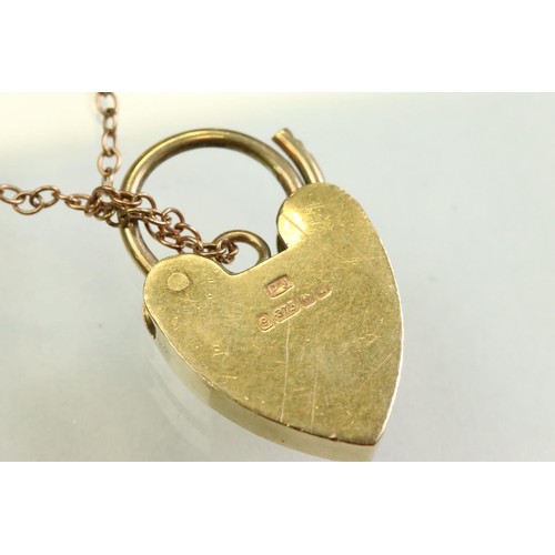 42 - 9ct yellow gold curb link bracelet, with padlock clasp and safety chain, each link stamped .375 and ... 