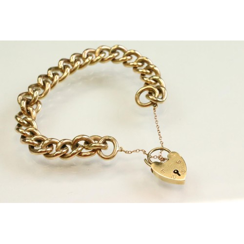 42 - 9ct yellow gold curb link bracelet, with padlock clasp and safety chain, each link stamped .375 and ... 