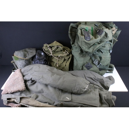 374 - A Collection Of Military Bags, Uniform And Respirator, Contained Within Three Large Boxes.