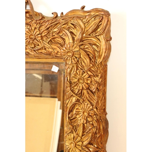 542 - Heavy ornate gilt framed wall mirror, 97cm x 68cm