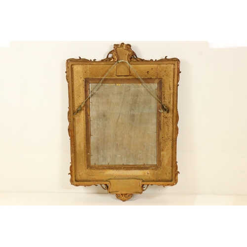 542 - Heavy ornate gilt framed wall mirror, 97cm x 68cm