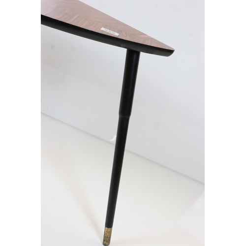 555 - Mid century Retro Coffee Table with wood effect shaped top, raised on three black tapering legs, 77c... 