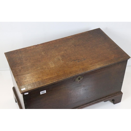 556 - 18th century Oak Coffer with hinged lid raised on bracket feet, 81cm wide x 44cm deep x 49cm high