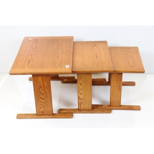 557 - Golden Ash Nest of Three Tables, largest 67cm wide x 45cm high