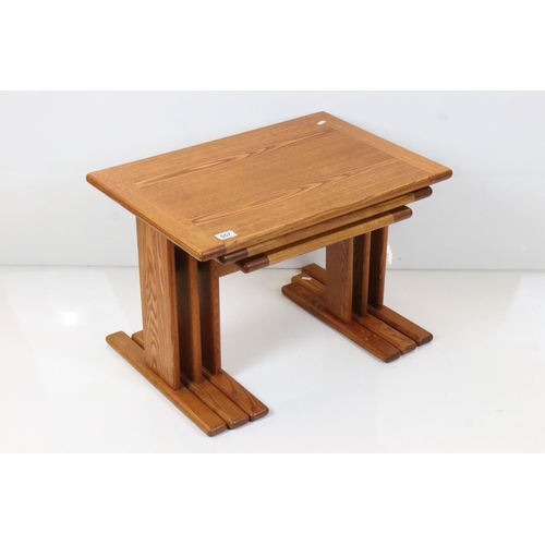 557 - Golden Ash Nest of Three Tables, largest 67cm wide x 45cm high