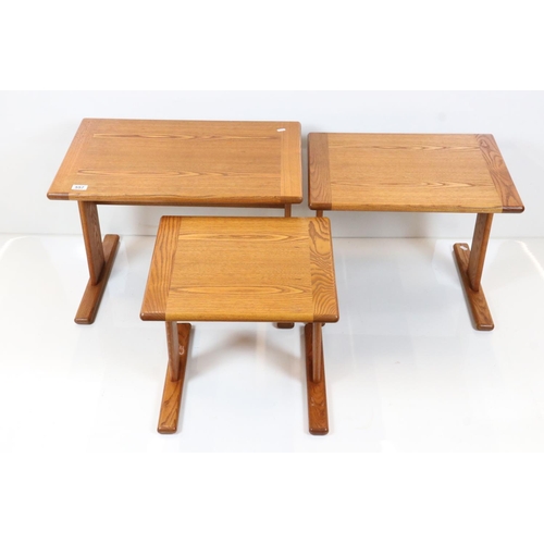 557 - Golden Ash Nest of Three Tables, largest 67cm wide x 45cm high