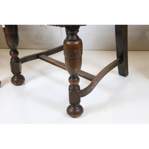 562 - Set of Four Oak Dining Chairs in the 17th century manner with brown leather effect and brass studded... 