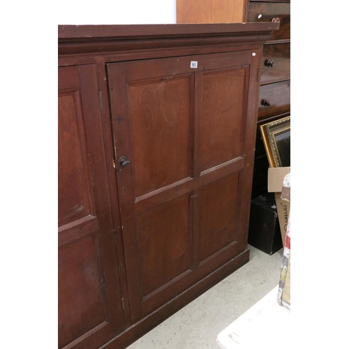 563 - Late 19th / Early 20th century Large Stained Pine Cupboard, the three panel doors opening to shelves... 