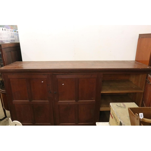 563 - Late 19th / Early 20th century Large Stained Pine Cupboard, the three panel doors opening to shelves... 