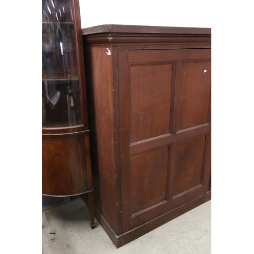 563 - Late 19th / Early 20th century Large Stained Pine Cupboard, the three panel doors opening to shelves... 