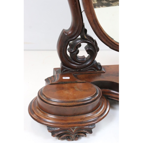 569 - Victorian Mahogany Oval Swing Mirror held on a shaped base with two hinged lid compartments, 80cm wi... 