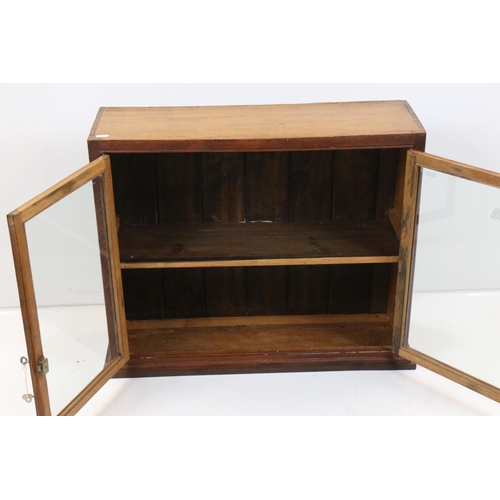 570 - Oak Wall Cabinet, the two glazed doors opening to shelf, with key, 72cm high x 57cm high