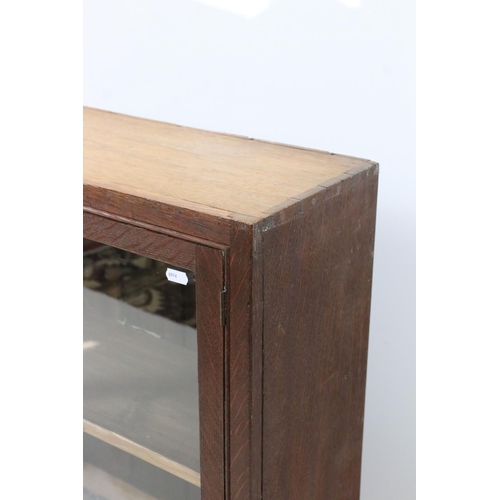 570 - Oak Wall Cabinet, the two glazed doors opening to shelf, with key, 72cm high x 57cm high