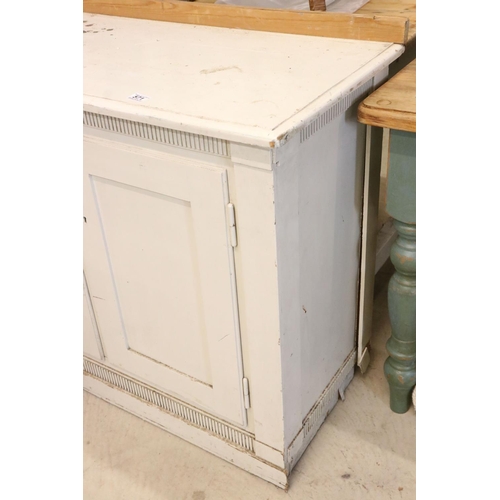 571 - Large 19th / Early 20th century Painted Pine Dresser Base with four sets of double panel doors, rais... 