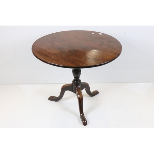 572 - George III Mahogany Circular Tilt Top Supper Table raised on a turned column with three splay legs, ... 