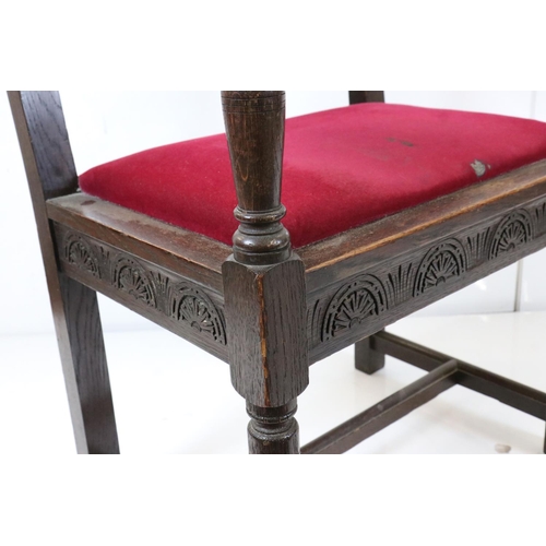 578 - In the manner of Liberty of London, Gothic Revival Oak Elbow Chair with carved back rail and upholst... 