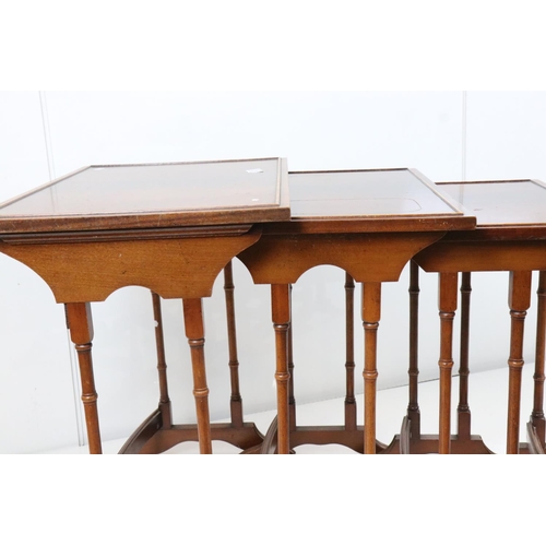 633 - Nest of Four Tables raised on slender faux bamboo legs, largest 59cm wide x 60cm high