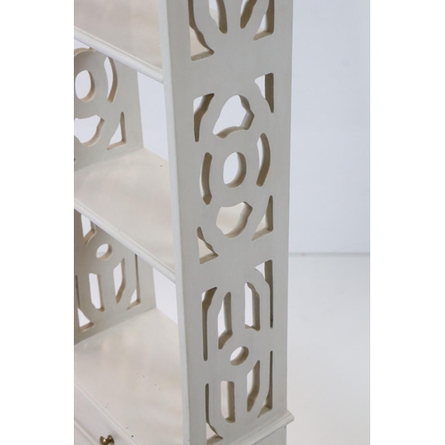 592 - Painted Bookcase with pierced sides and two drawers below, 34cm wide x 113cm high