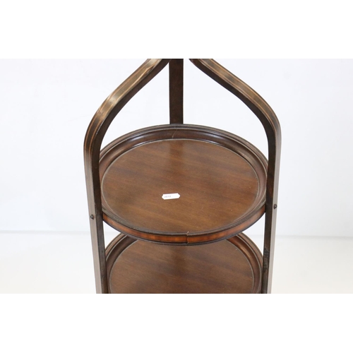 600 - Edwardian Inlaid Mahogany Three Tier Cake Stand with shaped top and three out-swept legs, 95cm high