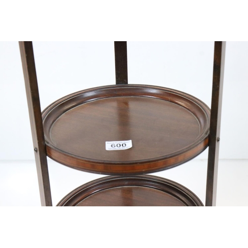 600 - Edwardian Inlaid Mahogany Three Tier Cake Stand with shaped top and three out-swept legs, 95cm high