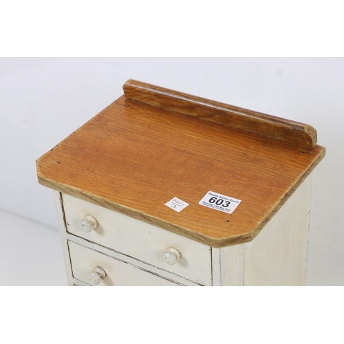 603 - Painted table top bank of six drawers, 28cm wide x 51cm high