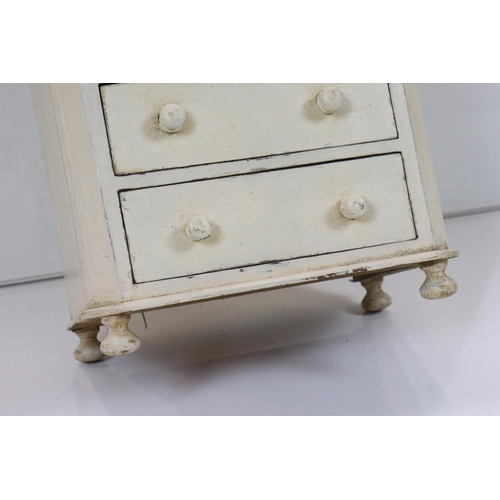 603 - Painted table top bank of six drawers, 28cm wide x 51cm high