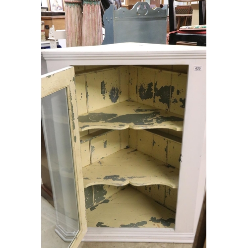 620 - 19th century Hanging Corner Cabinet, the single glazed door opening to two shaped shelves, later pai... 