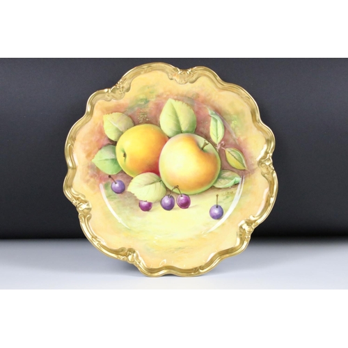20 - Pair of Coalport Cabinet Plates, hand painted with fallen fruits within a gilt wavy rim, one decorat... 