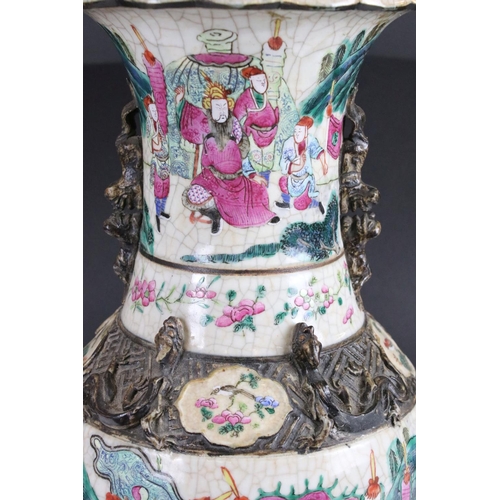 27 - Pair of Chinese Crackle Glaze Baluster Vases decorated in the Famille Rose palette with warriors in ... 