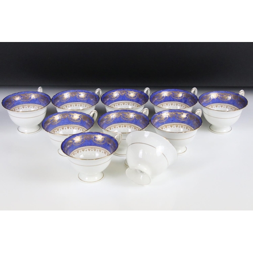 29 - Shelley Part Tea Service decorated with a blue band with gilt pattern on a white ground, comprising ... 