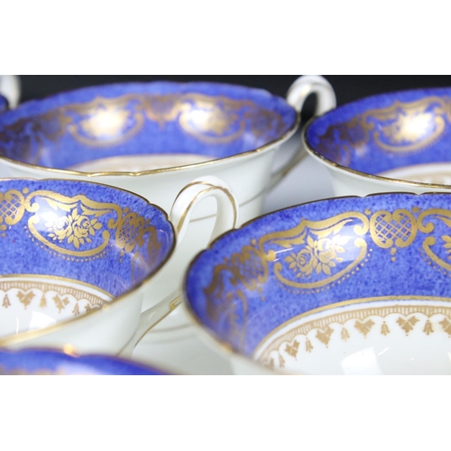 29 - Shelley Part Tea Service decorated with a blue band with gilt pattern on a white ground, comprising ... 