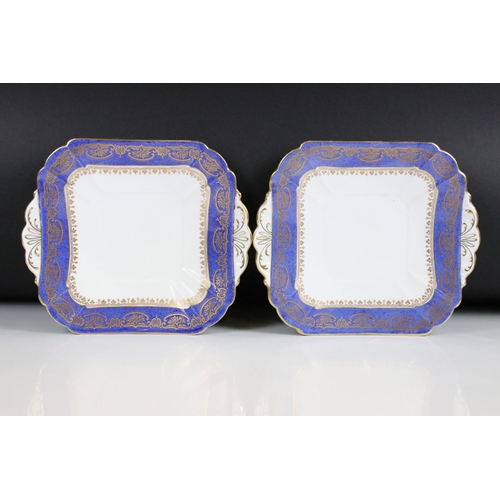 29 - Shelley Part Tea Service decorated with a blue band with gilt pattern on a white ground, comprising ... 