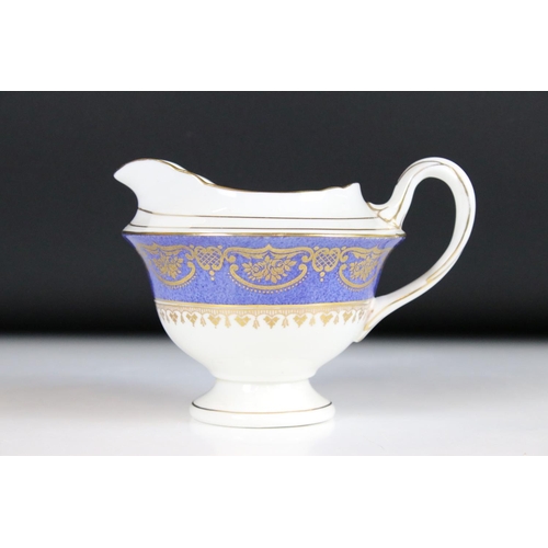 29 - Shelley Part Tea Service decorated with a blue band with gilt pattern on a white ground, comprising ... 