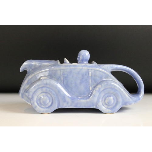 48 - 1930's Sadler Ceramic Blue Glazed Teapot in the form of a Racing Car and Driver, 23cm long together ... 