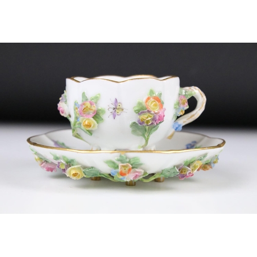 76 - Meissen floral encrusted cup and saucer, decorated with insects and flowers