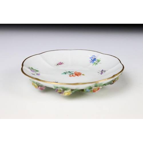 76 - Meissen floral encrusted cup and saucer, decorated with insects and flowers