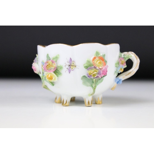 76 - Meissen floral encrusted cup and saucer, decorated with insects and flowers