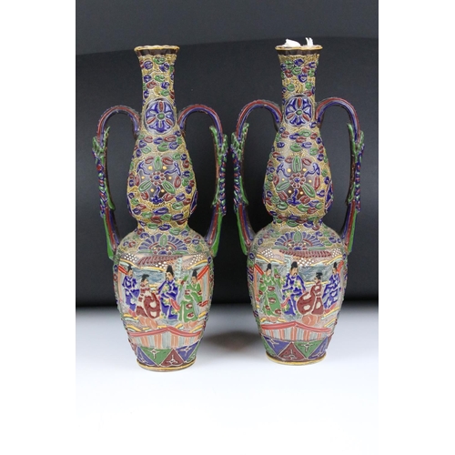 105 - A pair of Japanese twin-handled vases, 41.5cm high and another pair of Japanese baluster vases, 19cm... 