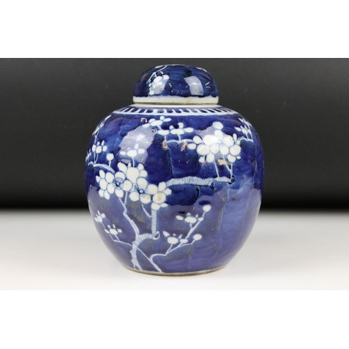 107A - A Chinese blue and white ginger jar and cover decorated with prunus blossom, 20cm high and three Chi... 