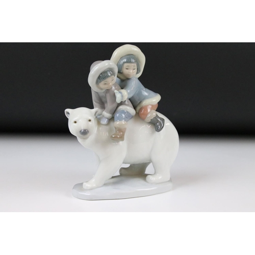 86 - Three Lladro figures, comprising: 1195 'Eskimo Playing, 5238 'Eskimo Boy with Pet' and 5353 'Eskimo ... 
