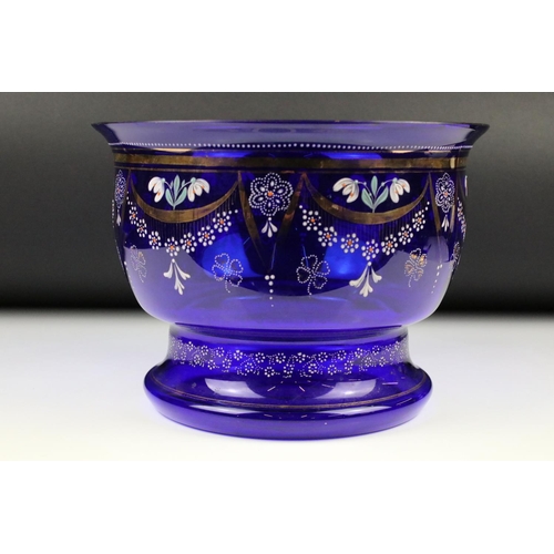 88 - Blue Glass Bowl with hand painted enamel and gilded floral decoration, 27cm diameter x 20cm high